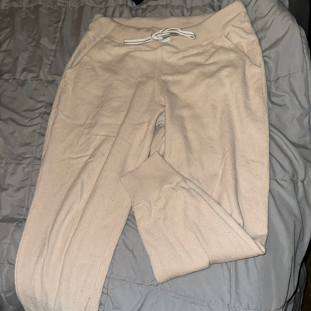 Cream sweatpants with white drawstring
